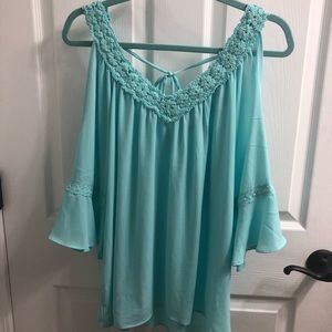 Open shoulder blouse.